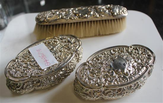 Silver dressing table boxes and a brush